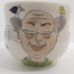 Emily Sabino painted pottery bald guy with birds